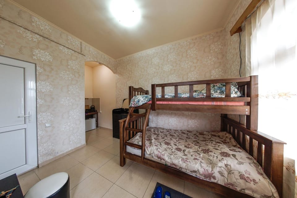 Kitchen or kitchenette, Living room, Photo of the whole room, Decorative detail, Decorative detail, Seating area, Dining area, bunk bed