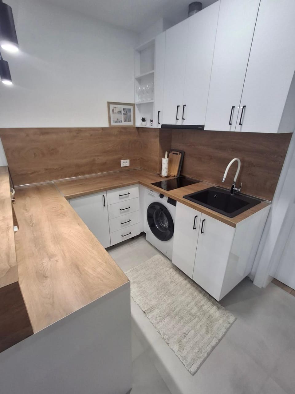 Kitchen or kitchenette, stove, washing machine