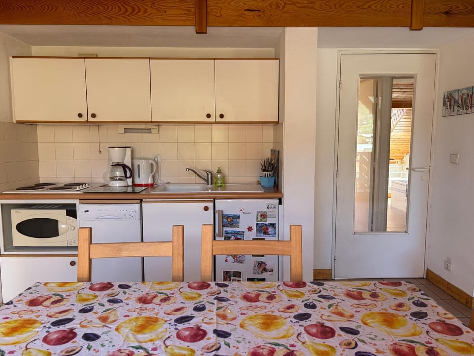 Kitchen or kitchenette, stove, toaster