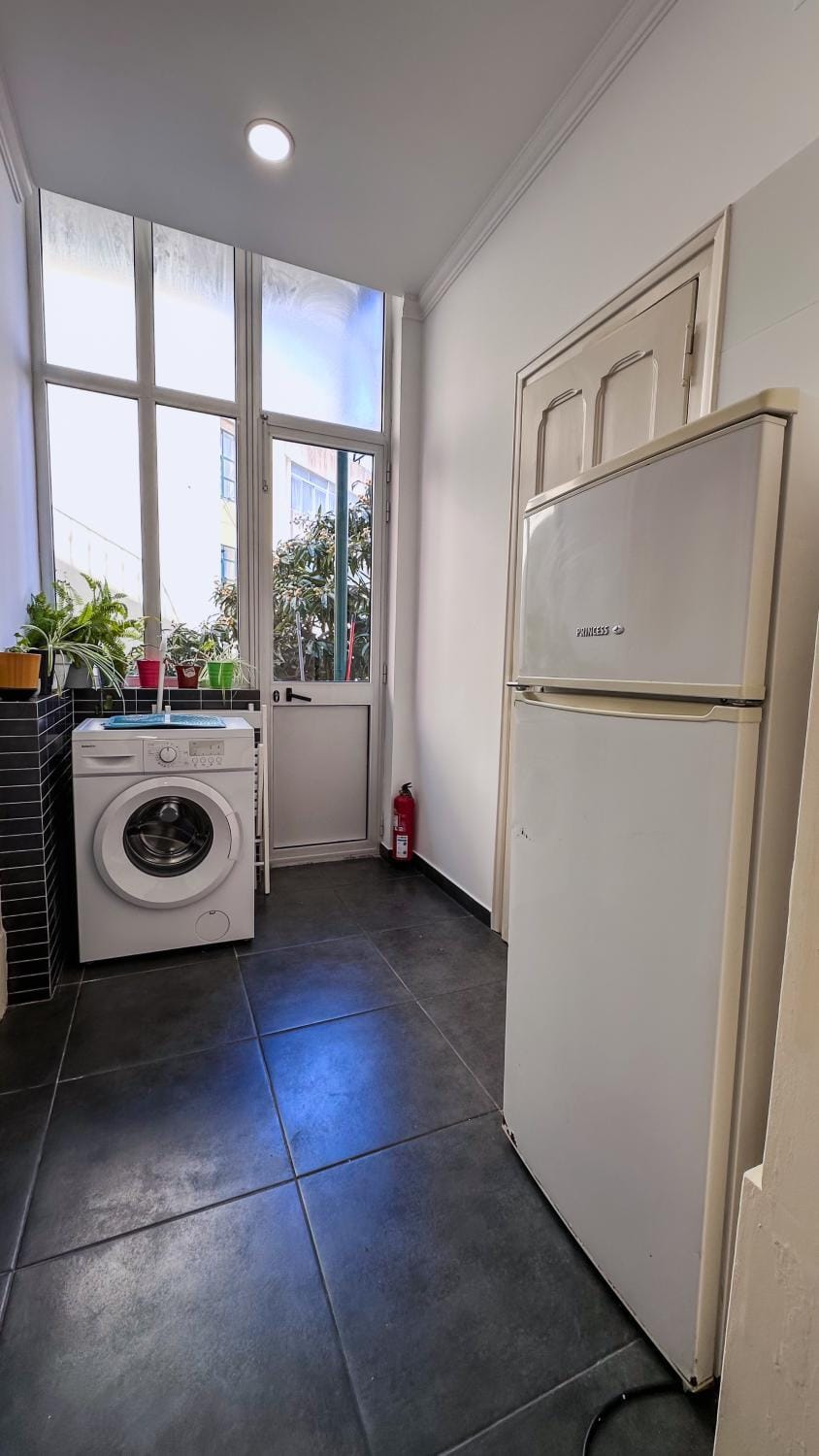 Kitchen or kitchenette, washing machine
