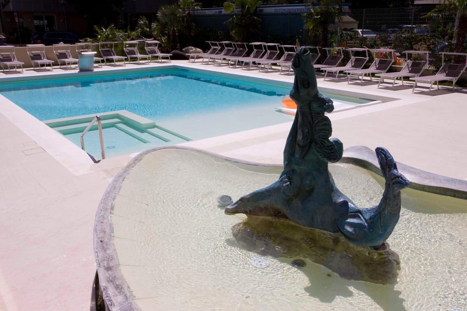 Property building, Facade/entrance, Decorative detail, Logo/Certificate/Sign, Garden view, Pool view, Street view, Swimming pool, Swimming pool