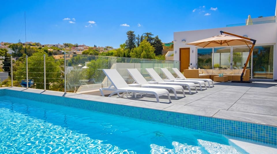 Property building, Patio, Day, Natural landscape, Pool view, Swimming pool, sunbed