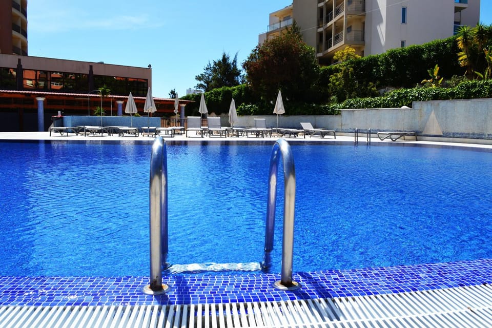 Property building, Patio, Staff, Communal lounge/ TV room, Spring, Day, People, Activities, Summer, Balcony/Terrace, Lounge or bar, Photo of the whole room, Decorative detail, Decorative detail, On site, Guests, Pool view, Swimming pool, Sports, children, young children, older children, group of guests, Family