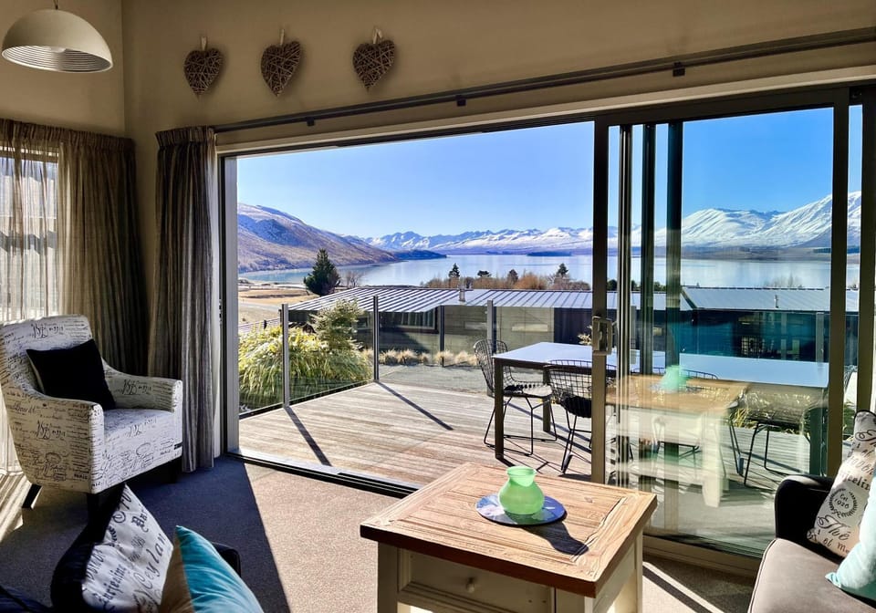 Property building, Patio, Living room, Seating area, Lake view, Mountain view