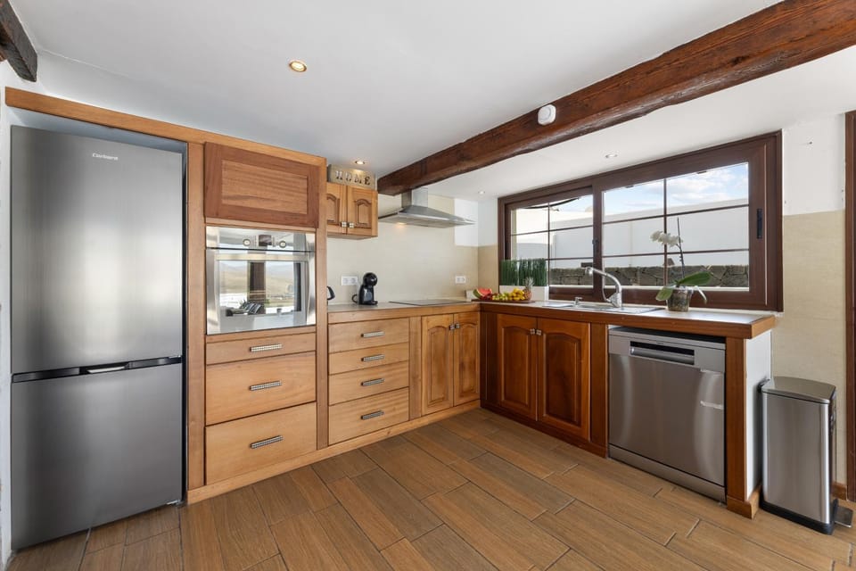 Kitchen or kitchenette, dishwasher, oven, stove