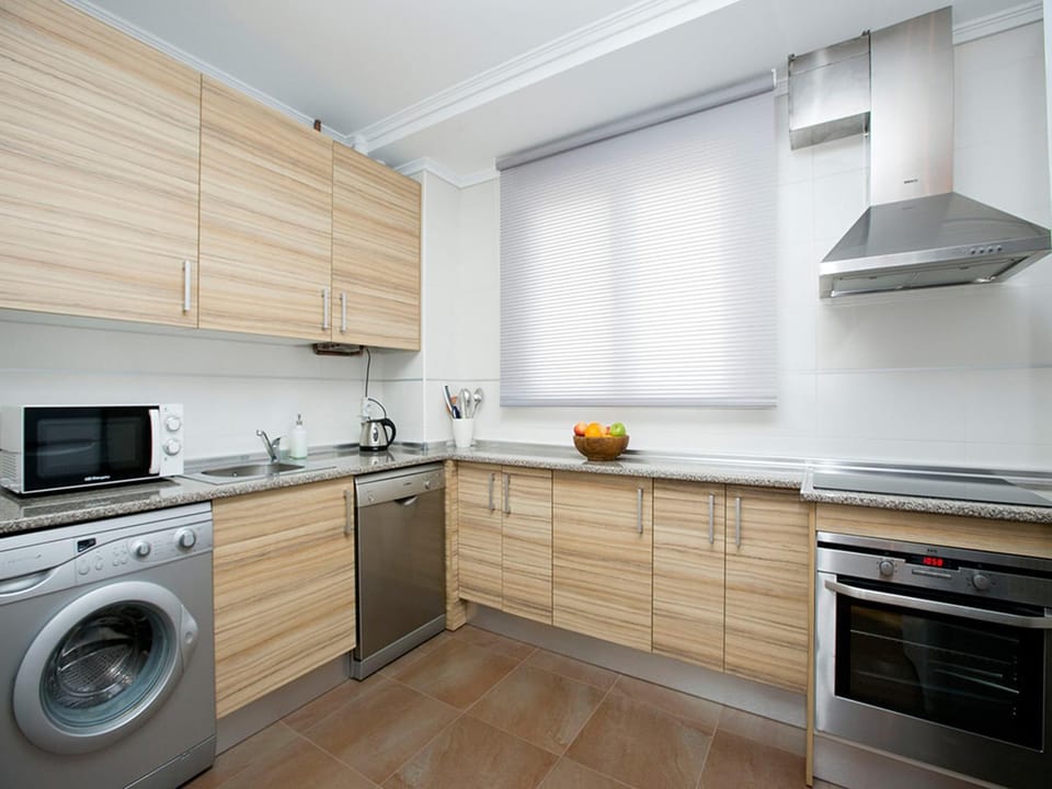 Kitchen or kitchenette, washing machine