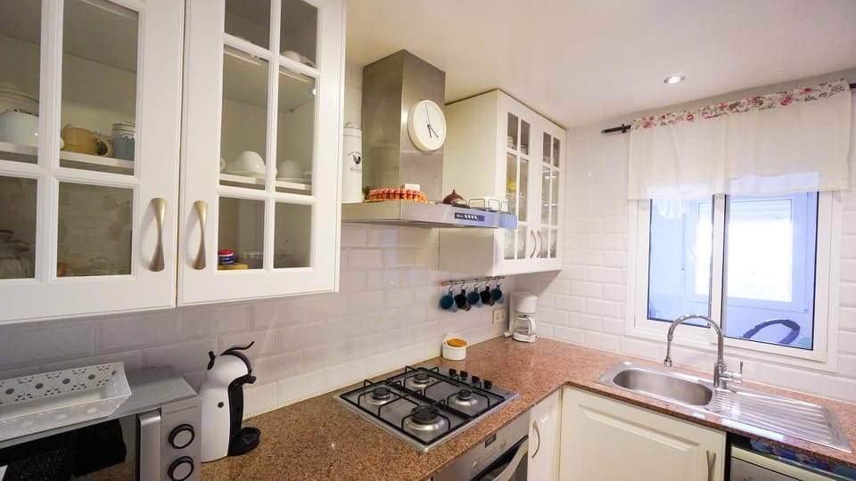 Kitchen or kitchenette, dishwasher, oven, stove, toaster