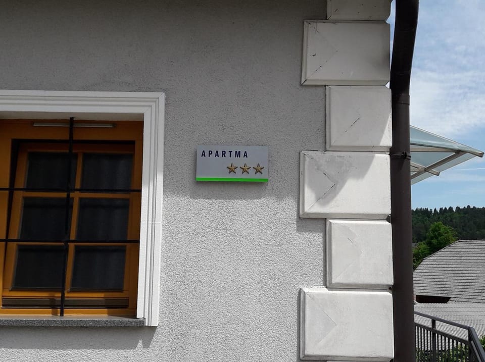 Facade/entrance, Property logo or sign, Decorative detail, Text overlay, Certificate/Award