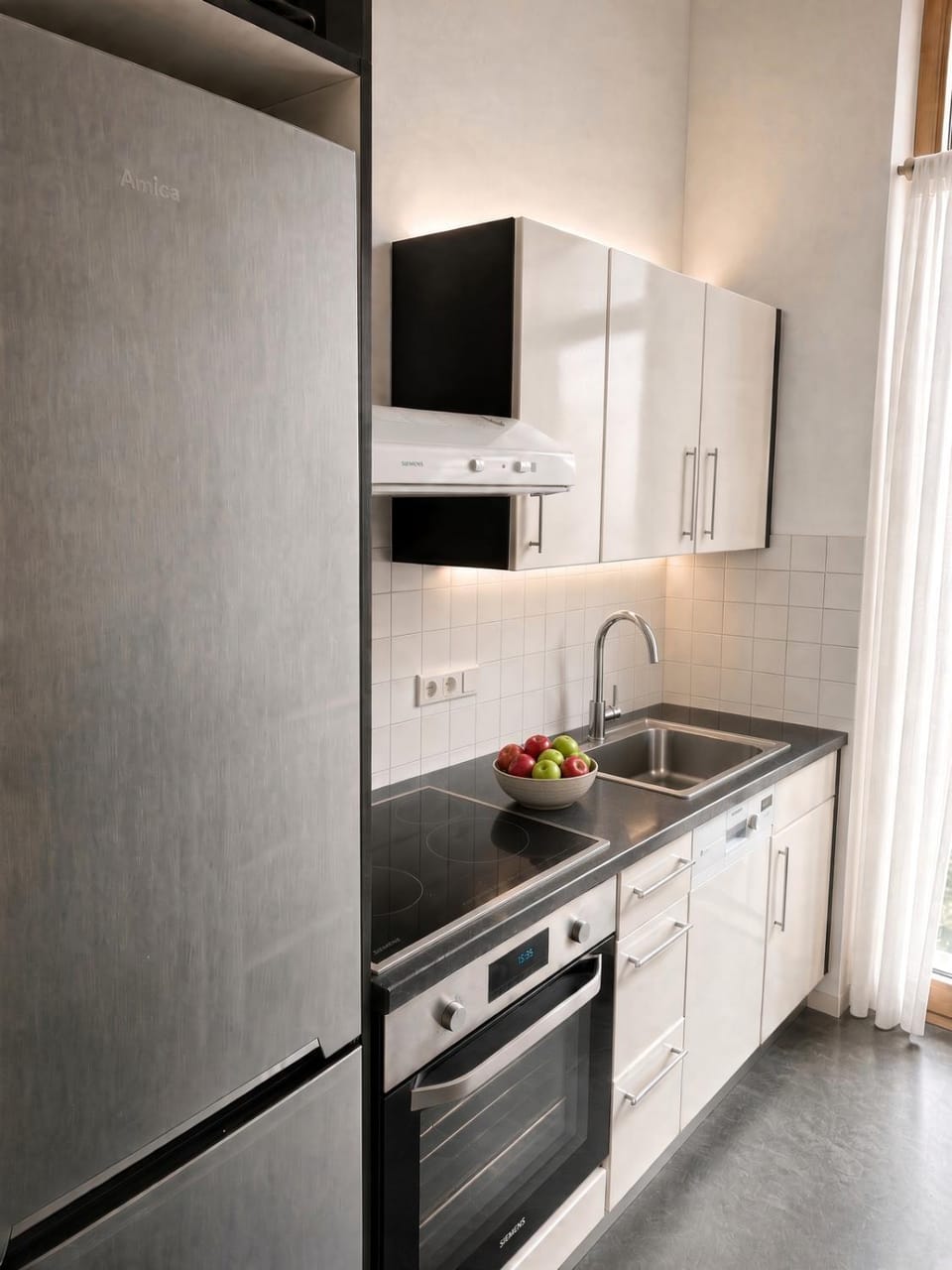 Kitchen or kitchenette, dishwasher, oven, stove