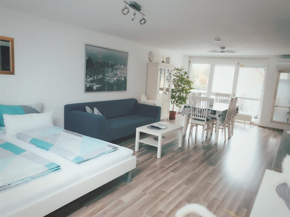 Bed, Living room, Seating area, Dining area