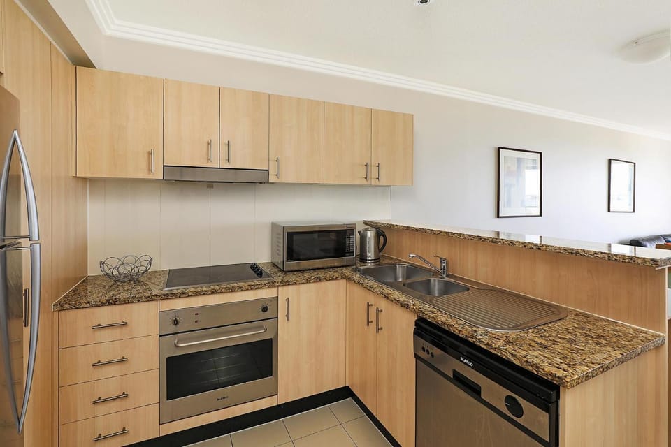 Kitchen or kitchenette, dishwasher, oven, stove