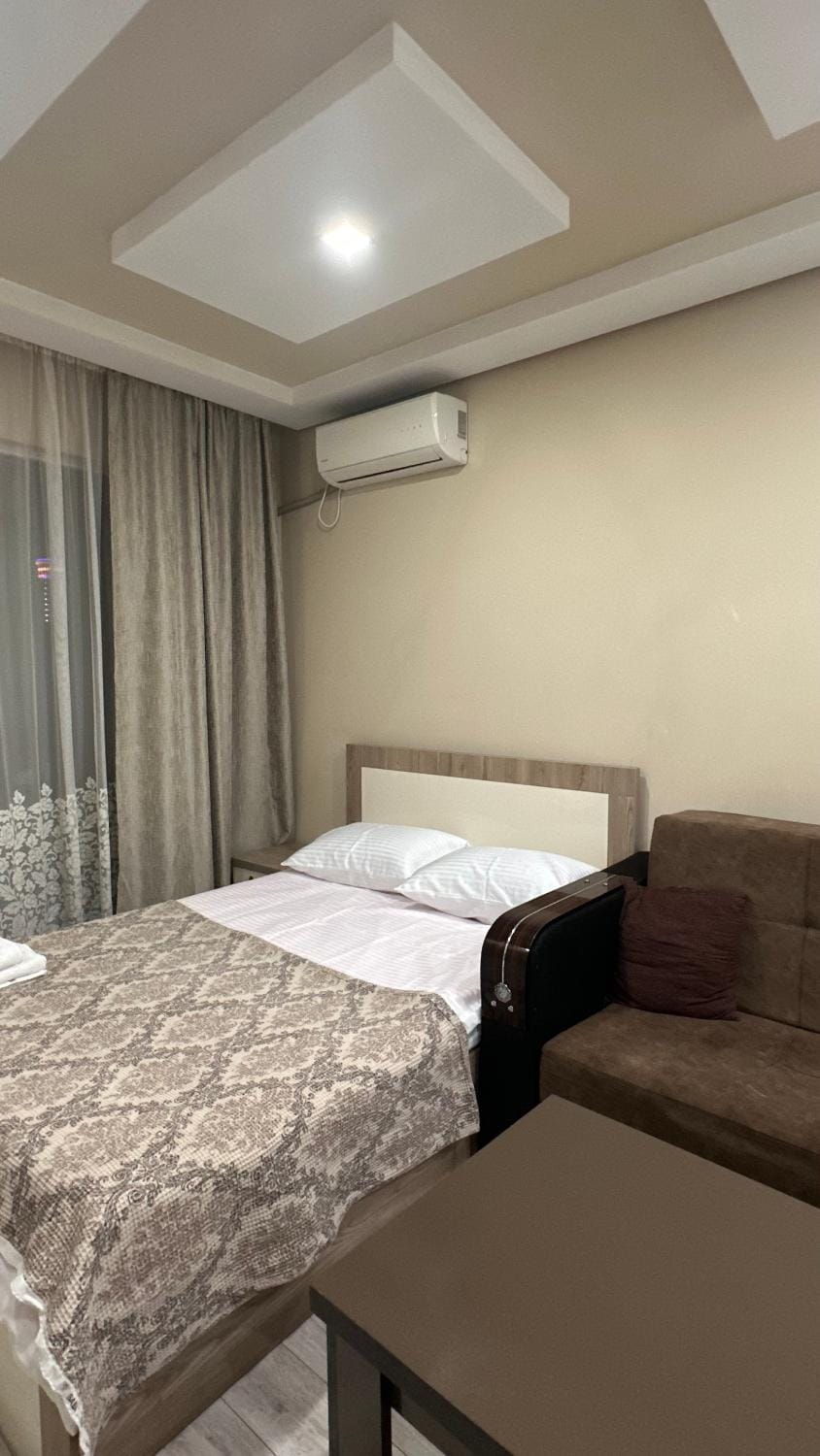 Bed, Living room, Photo of the whole room, Seating area, Bedroom, towels, air conditioner