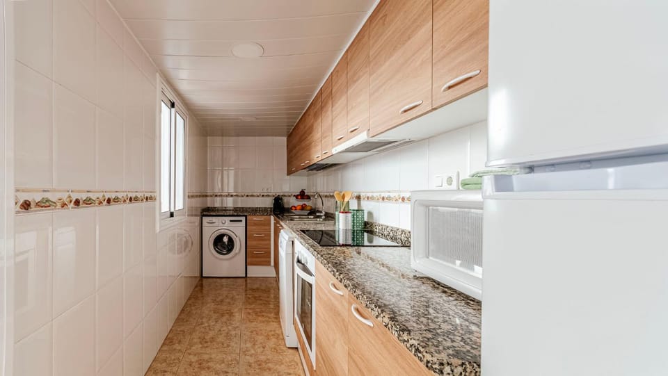 Kitchen or kitchenette, oven, stove, washing machine
