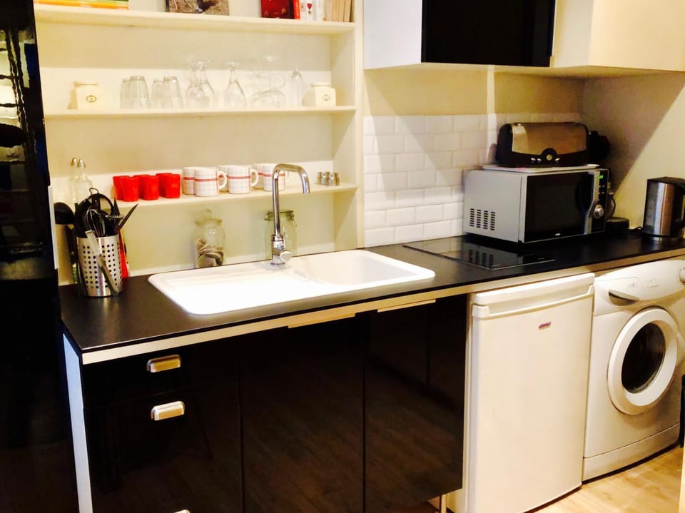 Staff, Staff, People, People, Coffee/tea facilities, Kitchen or kitchenette, Dining area, Pets, Pets, Certificate/Award, Family, Family, Inner courtyard view