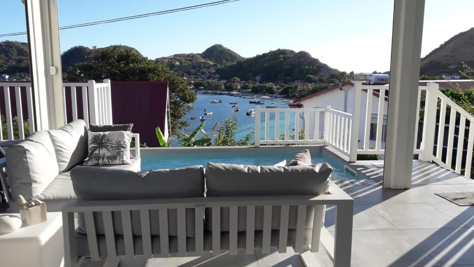 View (from property/room), Living room, Sea view, Swimming pool