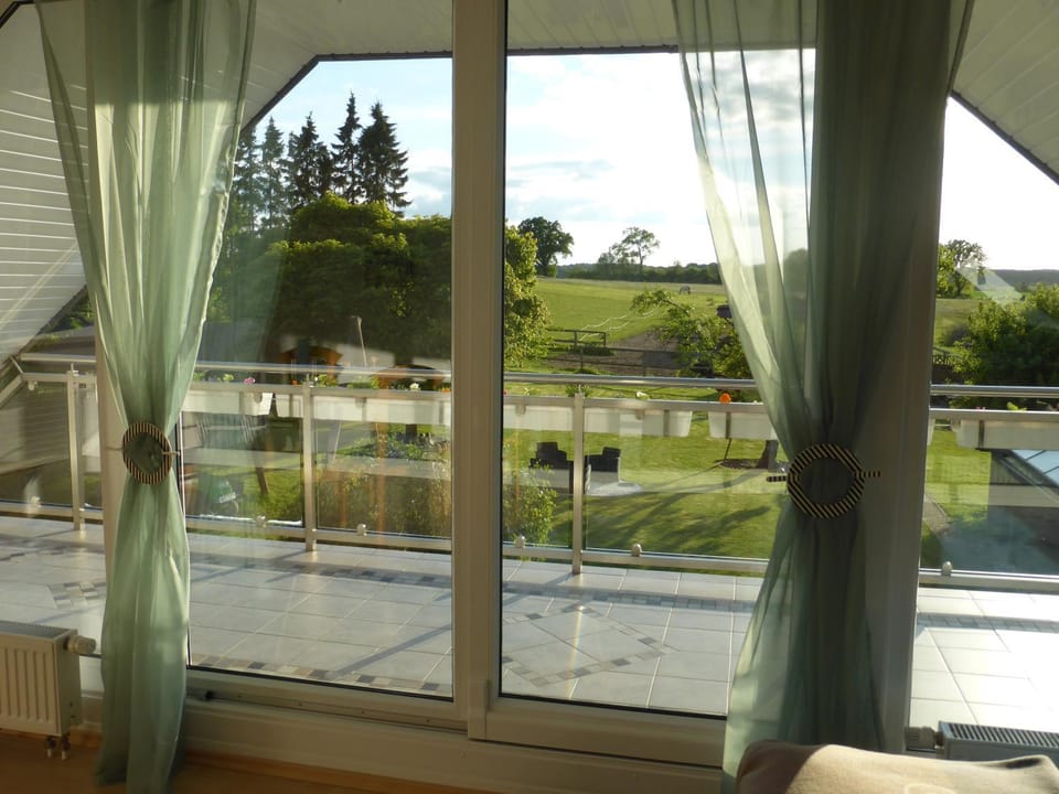 View (from property/room), Balcony/Terrace, Living room, Seating area, Garden view
