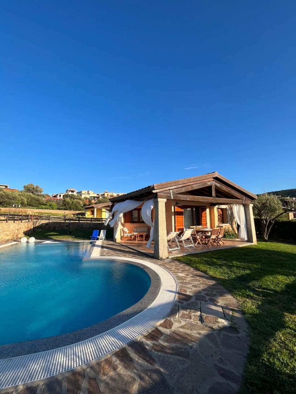Property building, Day, Natural landscape, Pool view, Swimming pool, sunbed