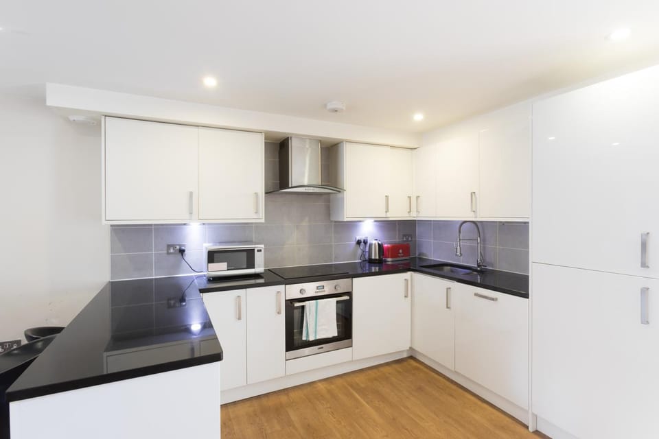 Kitchen or kitchenette, dishwasher, oven, stove, toaster