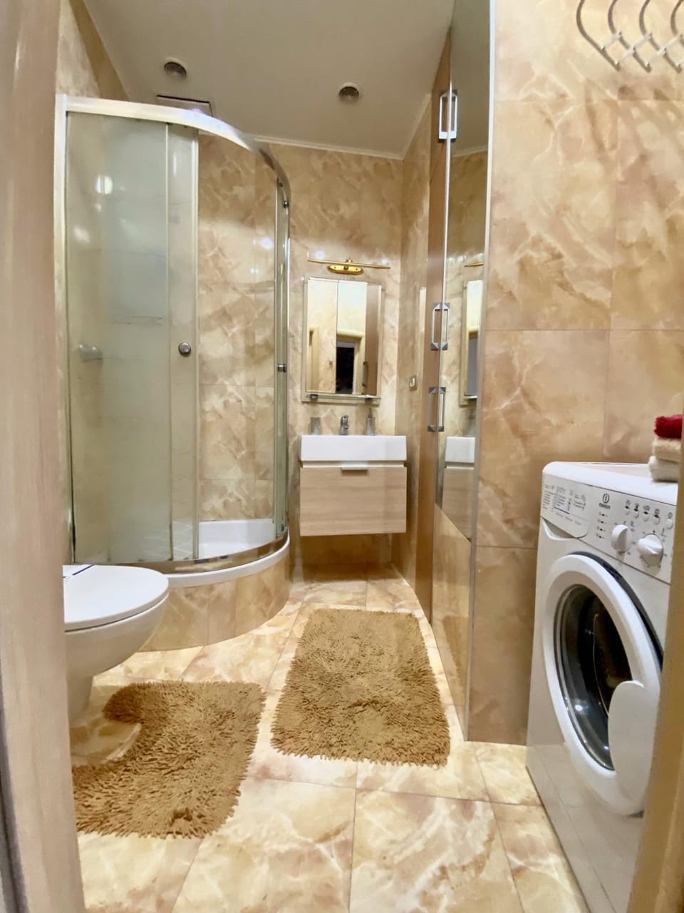 Shower, Toilet, towels, washing machine, dryer