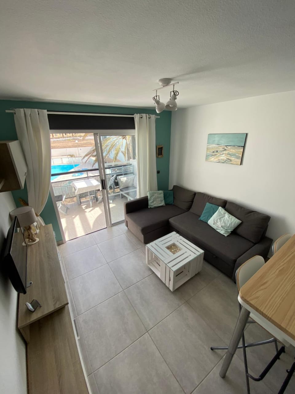 Living room, Seating area, Pool view