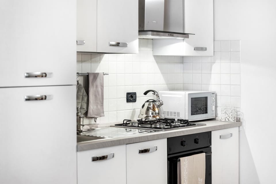 Kitchen or kitchenette, dishwasher, microwave, oven, stove