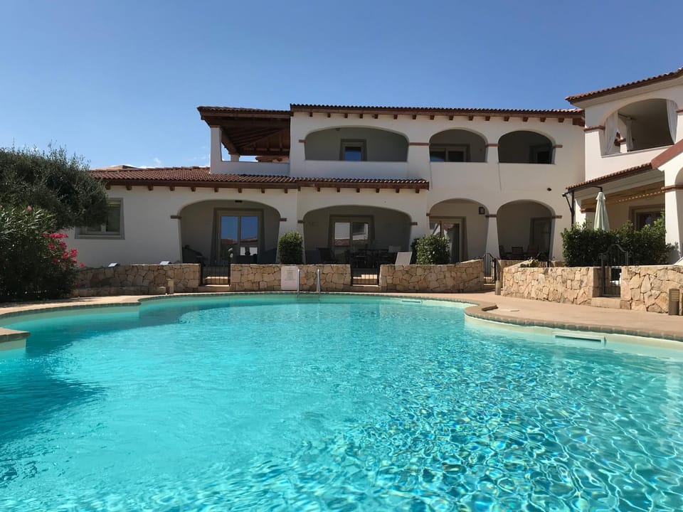 Property building, Patio, Day, Pool view, Swimming pool