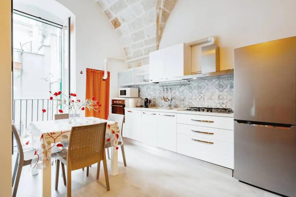 Kitchen or kitchenette, dishwasher, oven, stove