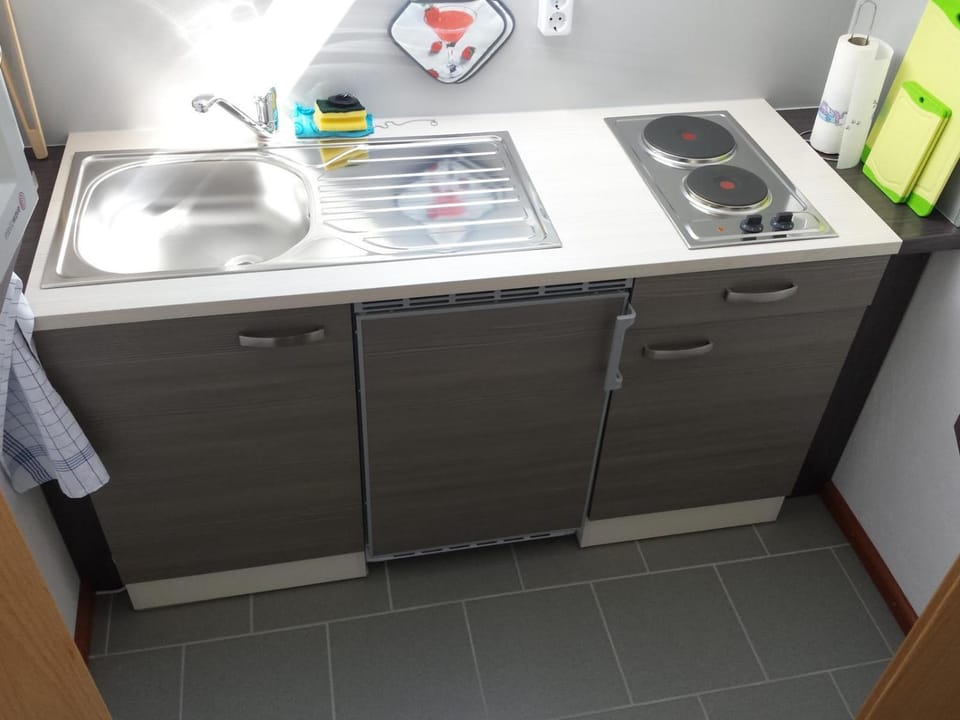 Kitchen or kitchenette, stove