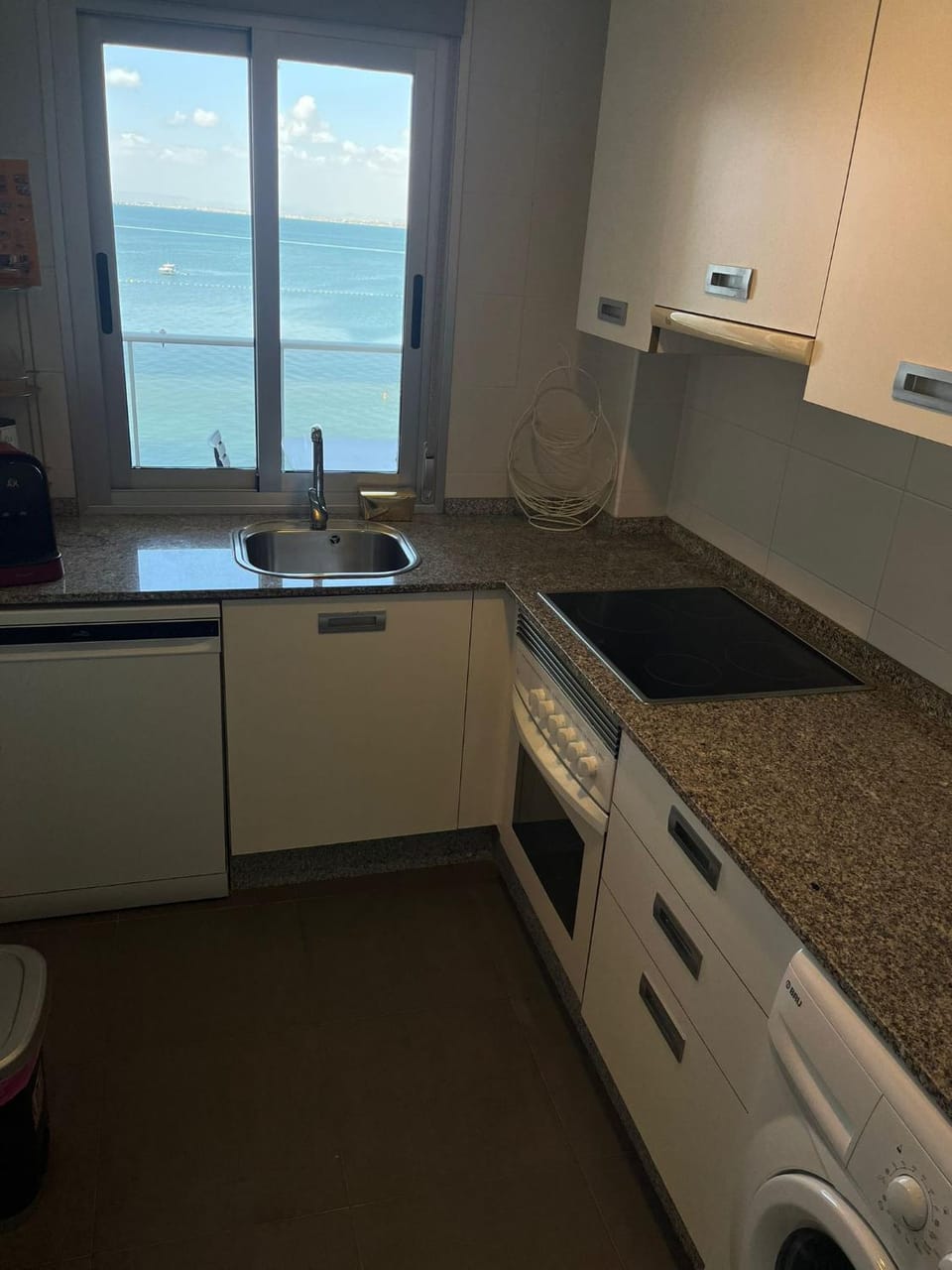 Kitchen or kitchenette, Sea view, dishwasher, stove, washing machine