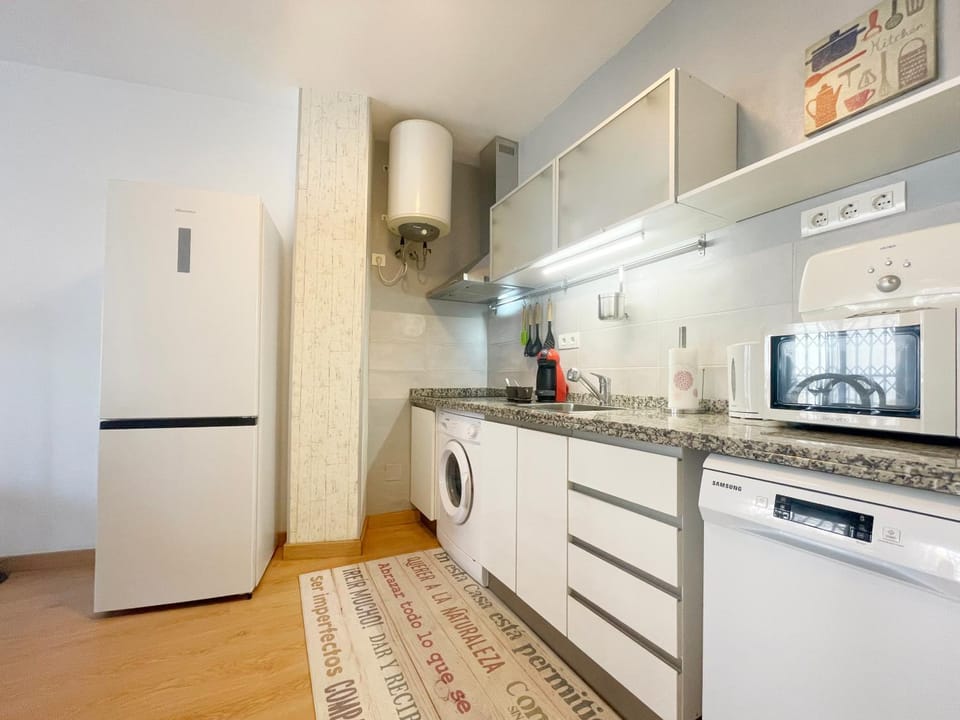 Kitchen or kitchenette, toaster, washing machine
