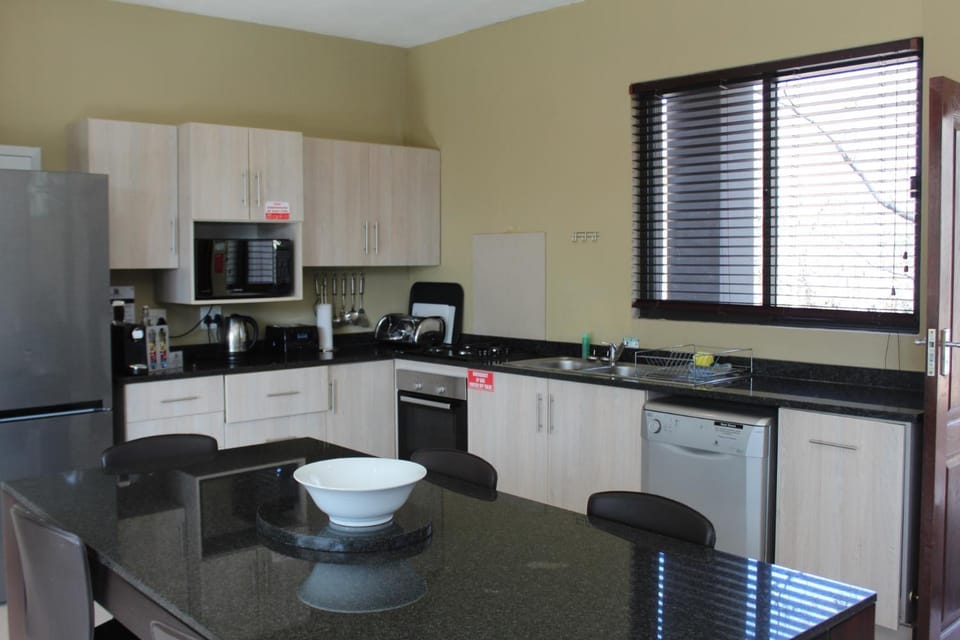 Kitchen or kitchenette, Dining area, dishwasher, oven, stove, toaster