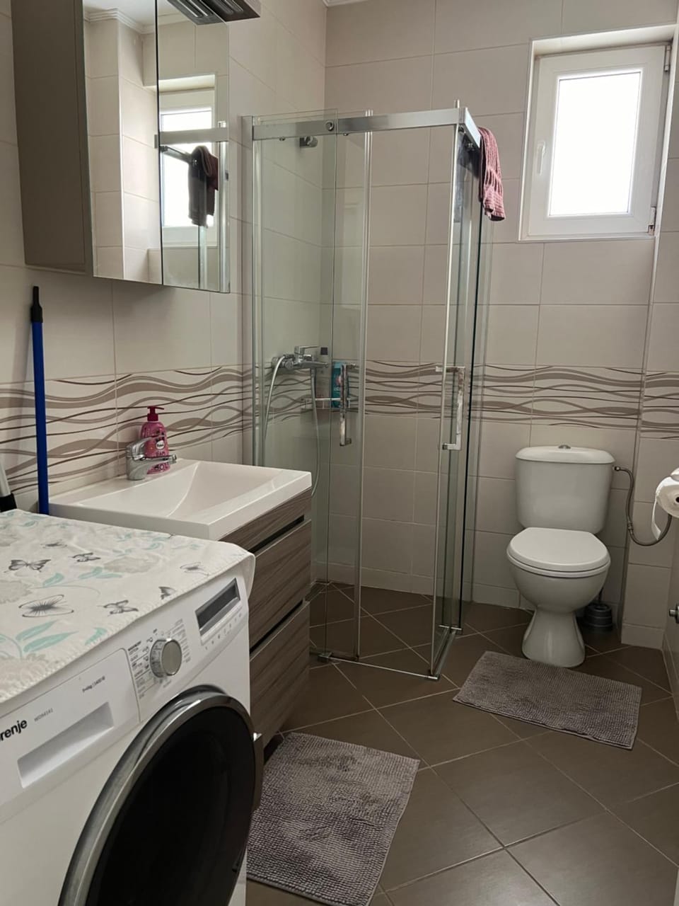 Shower, Toilet, Bathroom, towels, washing machine, dryer
