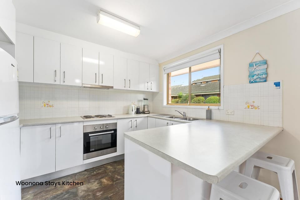 Kitchen or kitchenette, dishwasher, oven, stove, toaster