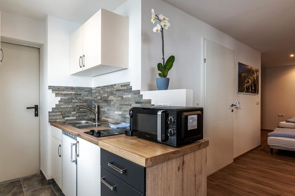 Kitchen or kitchenette, microwave, stove, kitchen