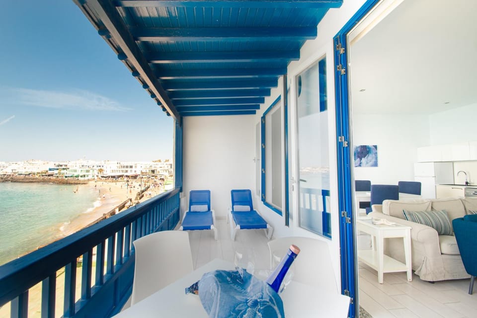Natural landscape, View (from property/room), Balcony/Terrace, Living room, Dining area, Beach, Sea view, locker, sunbed, towels