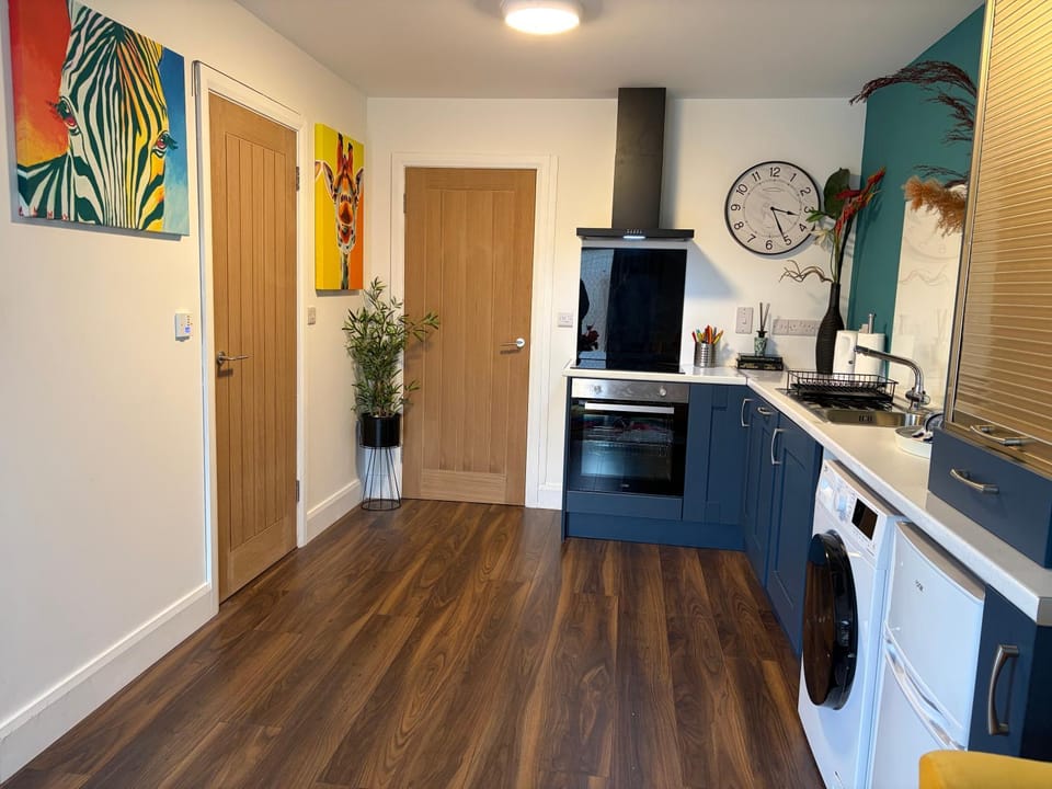 Kitchen or kitchenette, dishwasher, oven, stove, washing machine, dryer