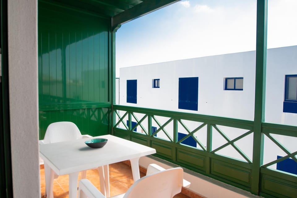 View (from property/room), Balcony/Terrace, Dining area, Beach, sunbed, towels, air conditioner