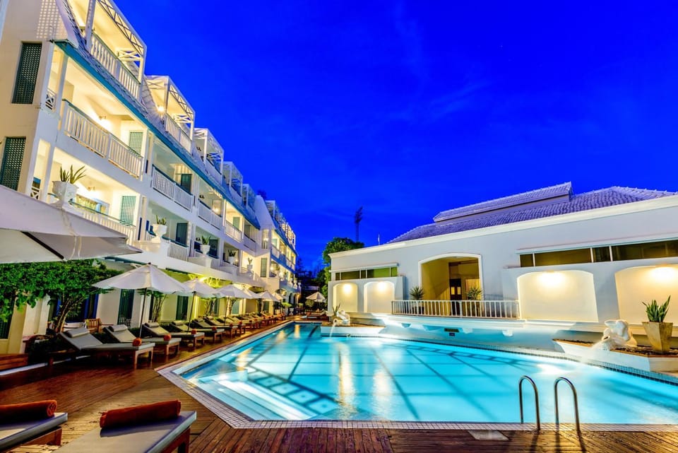 Property building, Facade/entrance, Night, Pool view, Swimming pool, sunbed