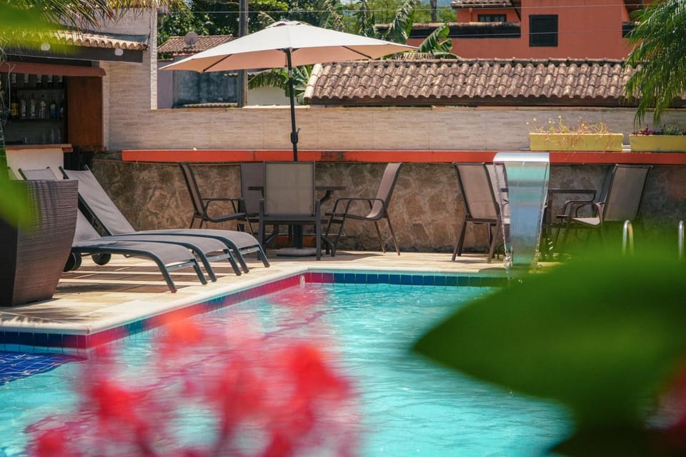 Property building, Patio, Pool view, Swimming pool, sunbed