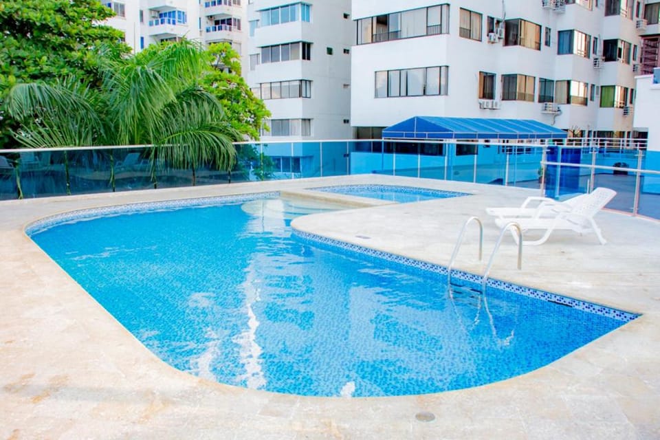 Property building, Day, Pool view, Swimming pool, sunbed