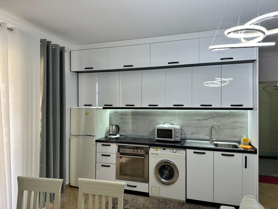 Kitchen or kitchenette, stove, washing machine