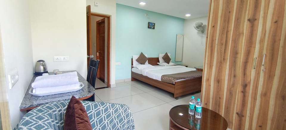 Bed, Seating area, Bedroom, towels, wardrobe