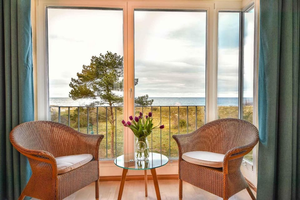 Natural landscape, View (from property/room), Living room, Seating area, Sea view