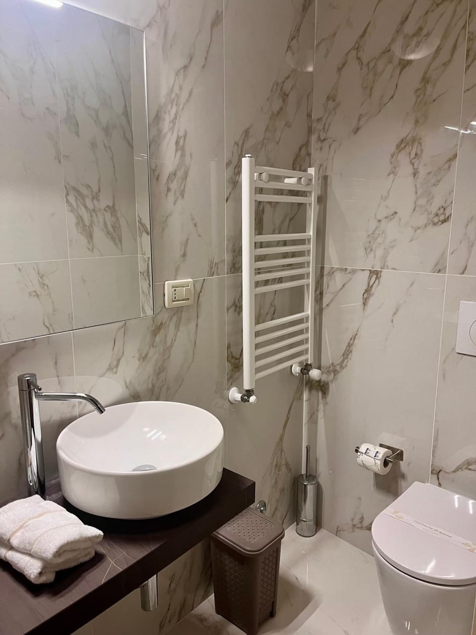 Bathroom, bidet, furniture, hair dryier, towels