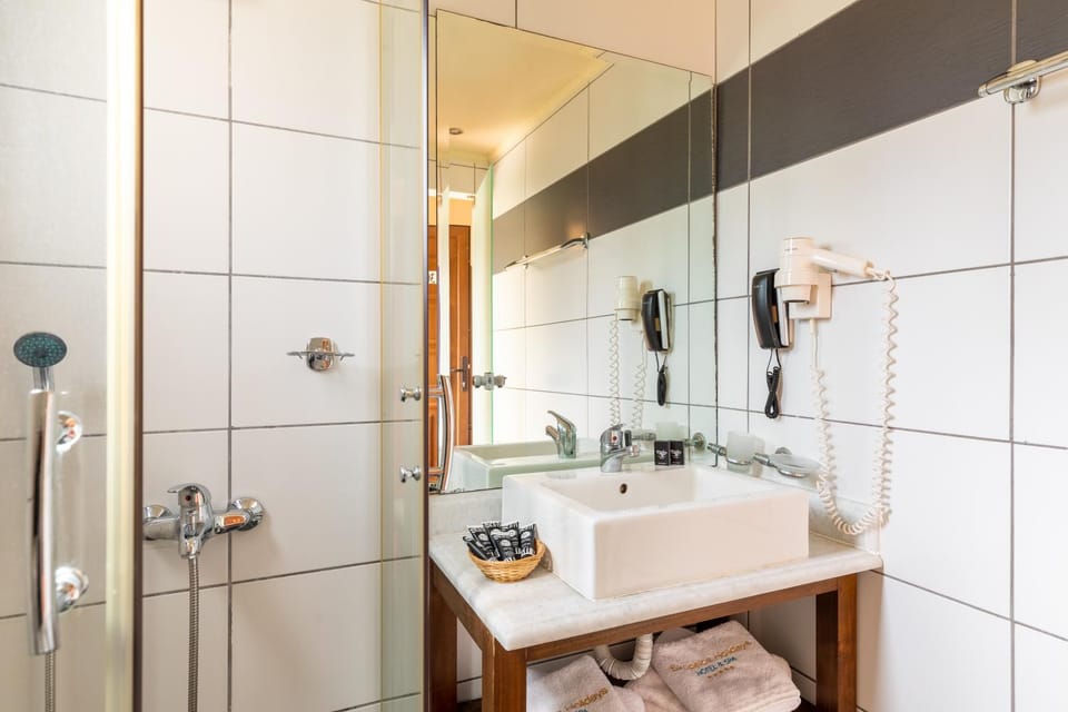 Shower, Toilet, Bathroom, hair dryier, towels