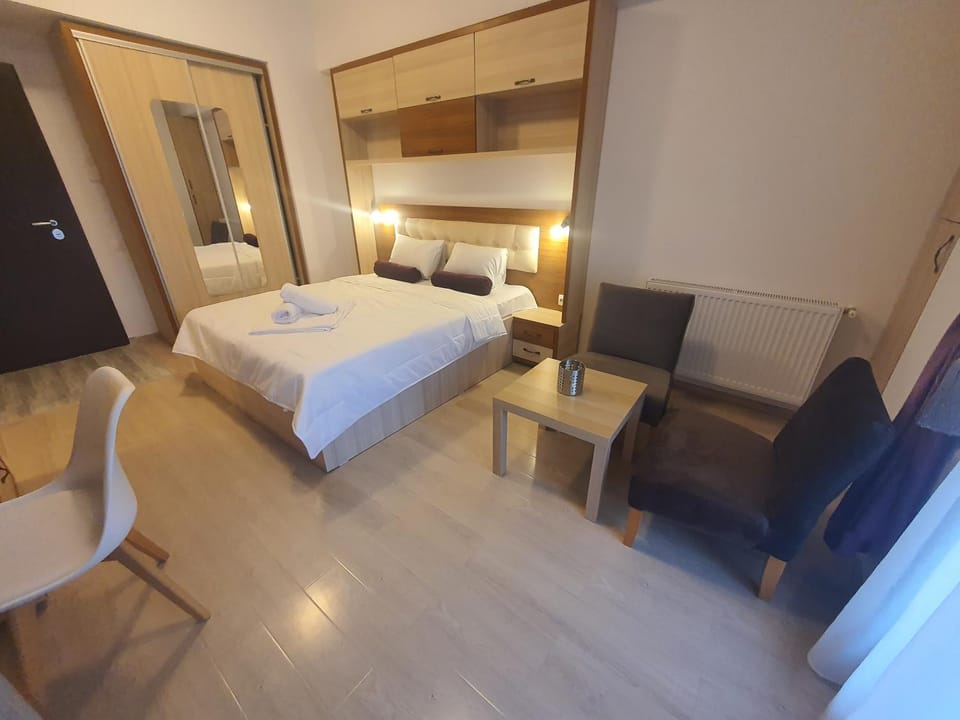 Bed, TV and multimedia, Seating area, Bedroom, hair dresser