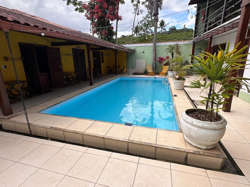 Property building, Day, Pool view, Swimming pool, sunbed