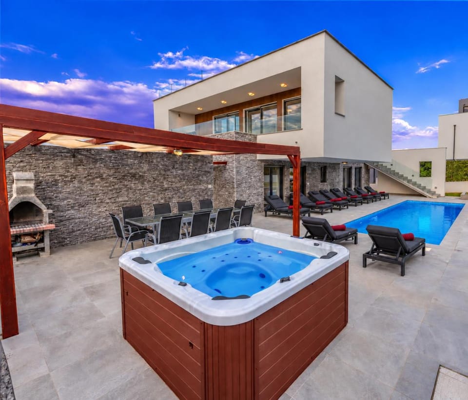 Patio, Hot Tub, Pool view, sunbed