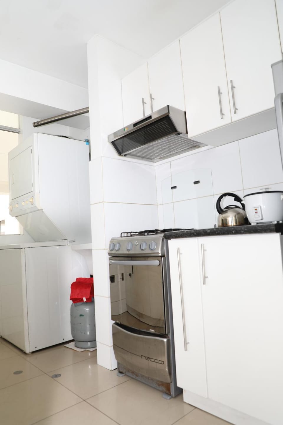 Kitchen or kitchenette, oven, stove, washing machine