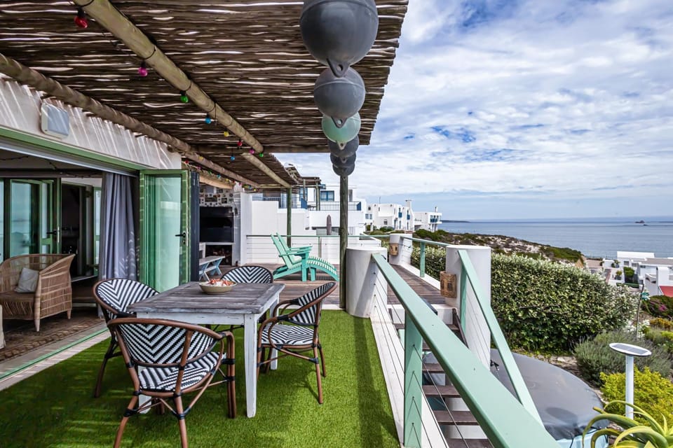 Property building, Patio, Natural landscape, View (from property/room), Balcony/Terrace, Living room, Seating area, Dining area, Sea view